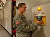 mobilized pallet racking in military warehouse facility with keypad controls
