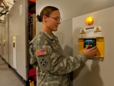 mobilized pallet racking in military warehouse facility with keypad controls