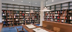 Tall Library Shelving for Book Storage along Wall