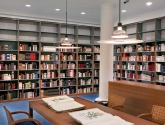 Tall Library Shelving for Book Storage along Wall